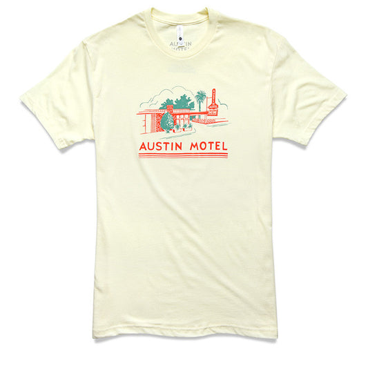 A cream t-shirt with a colorful illustration of the Austin Motel building and the text 'AUSTIN MOTEL' printed across the chest.